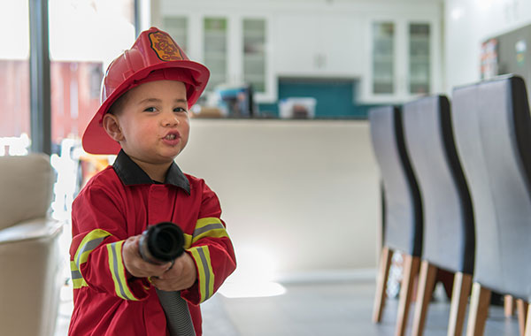 Photo of young boy dressed as a firefighter